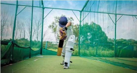 Batsman practising in a cricket net