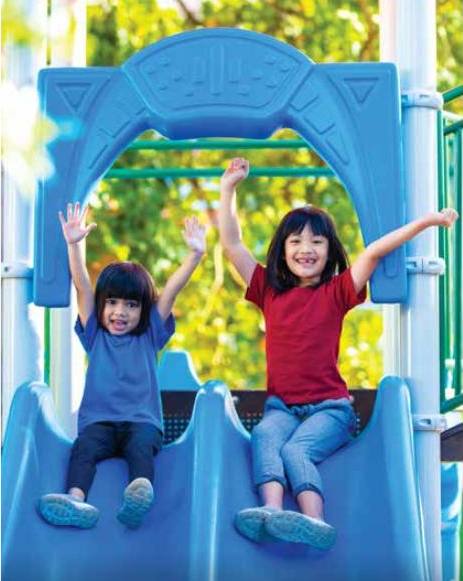 Two children on a playground slide