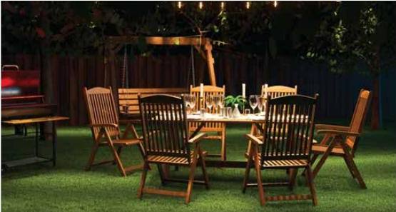 Dining table set on a lawn at night