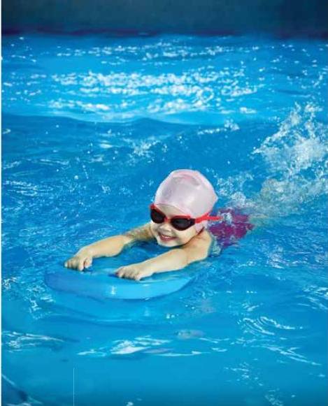 Child swimming with a float in a pool