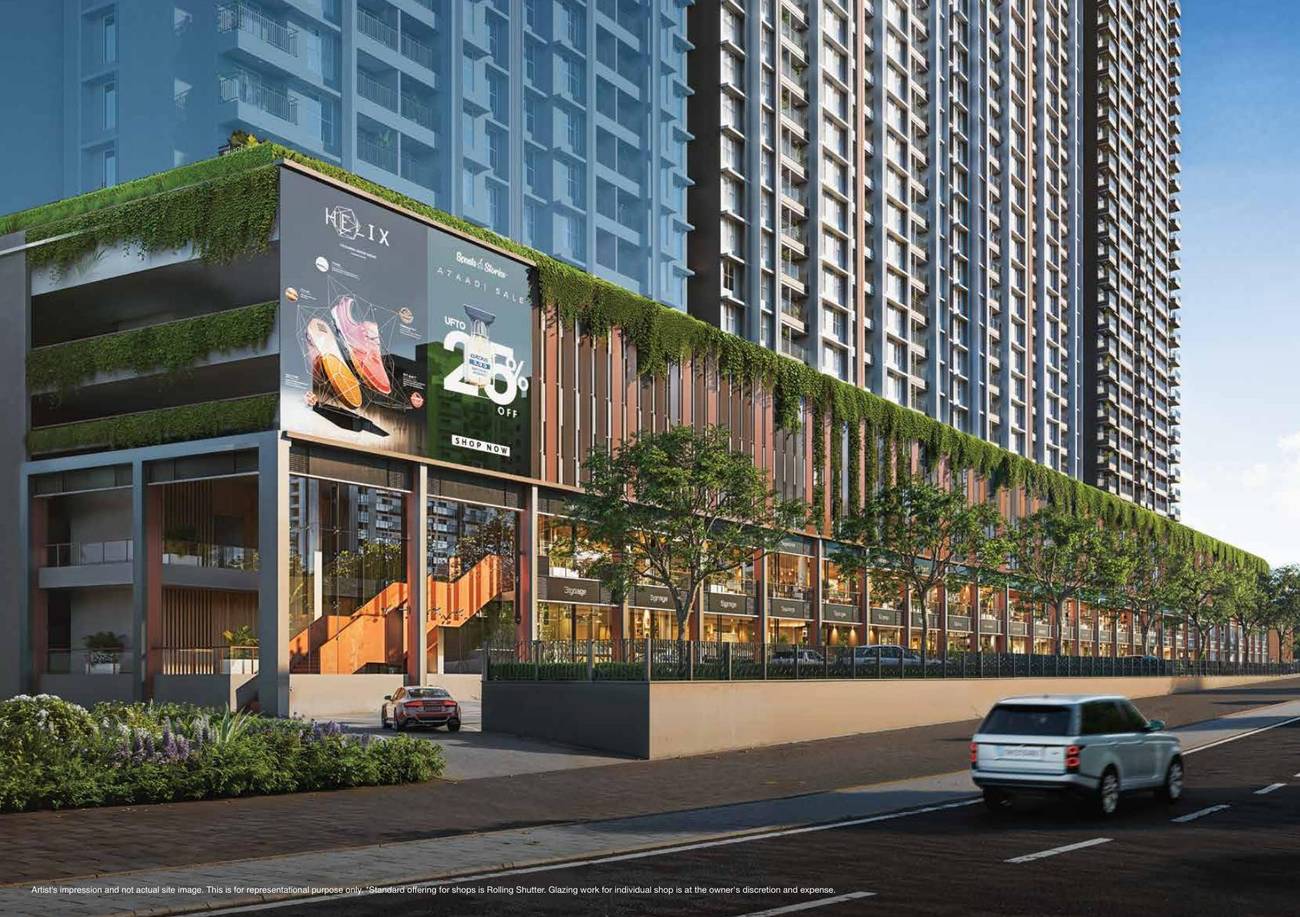 Two-level retail frontage with green planters below the residential towers