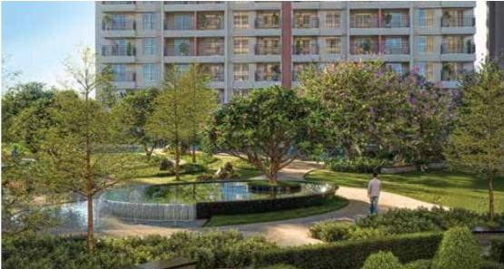 Circular water feature surrounded by gardens